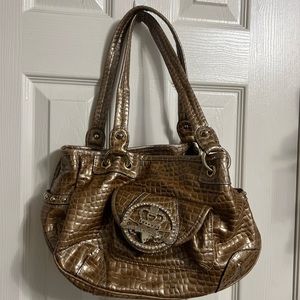 Kathy Van Zeeland bag the exterior features a beautiful golden/brownish vinyl